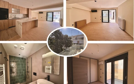 Open-plan kitchen with wood cabinets and a marble island, adjacent to a bright living area.
